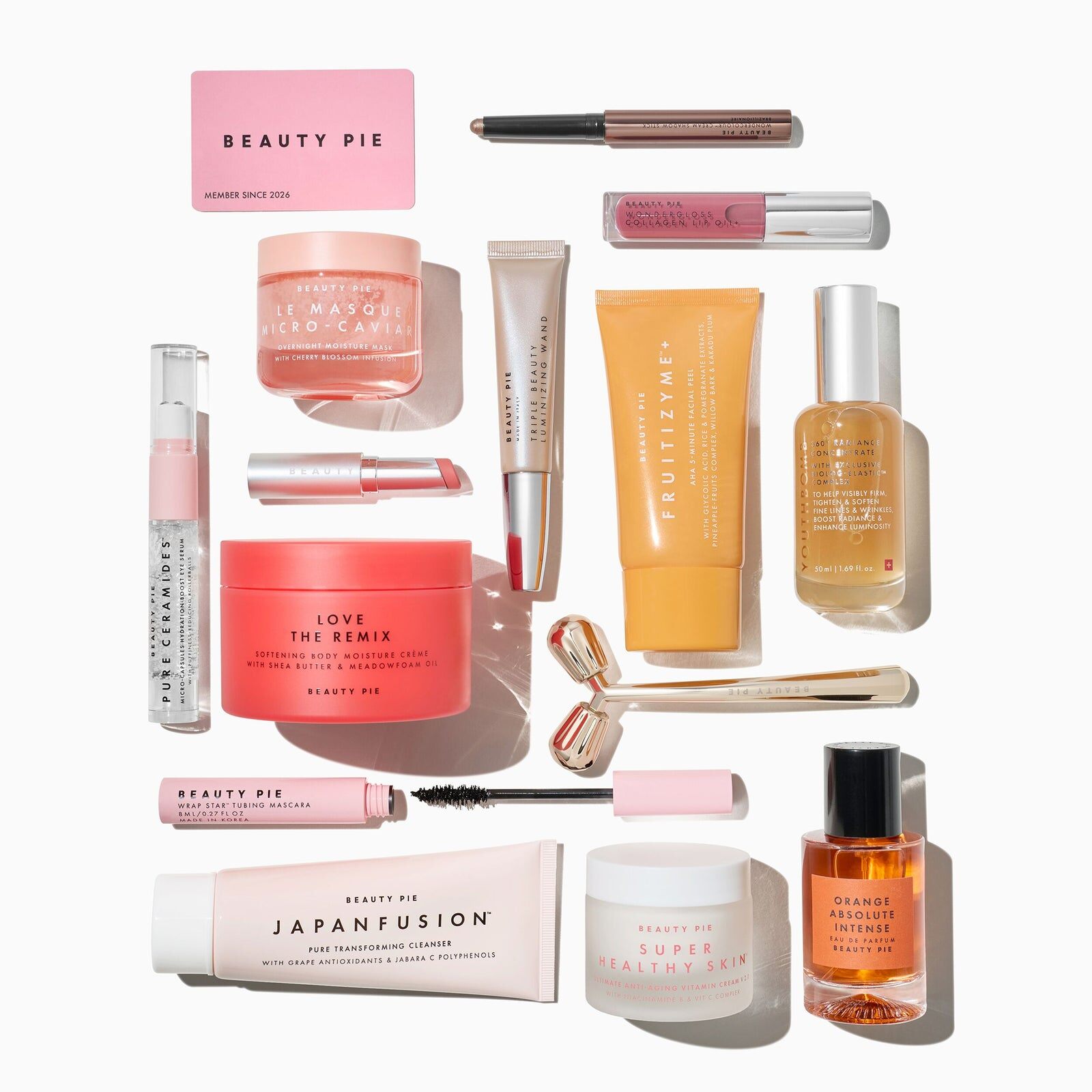A Beauty Pie graphic listing the 14 products of the box next to a flat lay of the products
