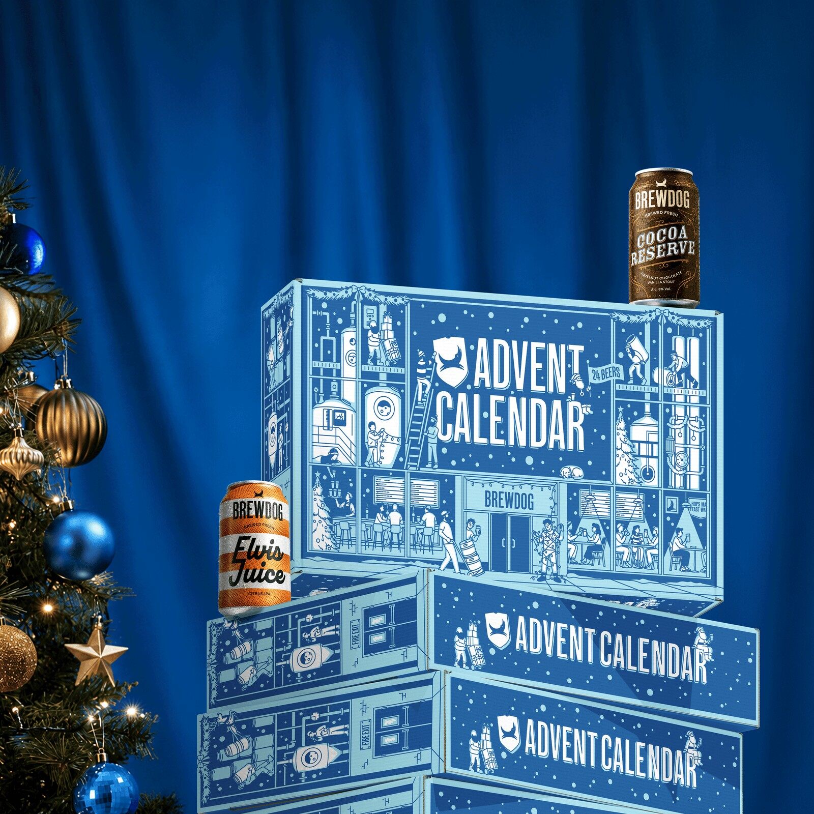 Stacked BrewDog advent calendar 2026 boxes in pale blue with cans of Elvis Juice and Cocoa Reserve, next to a Christmas tree