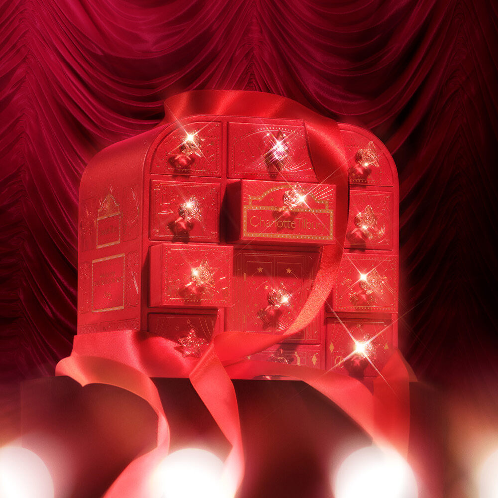 The closed Charlotte Tilbury Hollywood Beauty Wonderland advent calendar 2026, a red box with gold stars and jewel handles