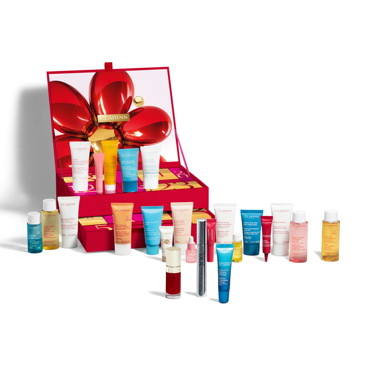 The open Clarins 24 Day Beauty Advent Calendar 2026, a red box with a large red flower on the lid, with its skincare and make-up products lined up in front