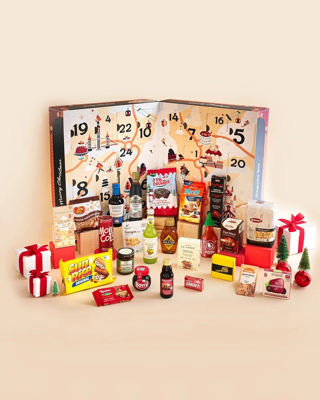 A previous Degustabox advent calendar open with its food and drink products laid out in front