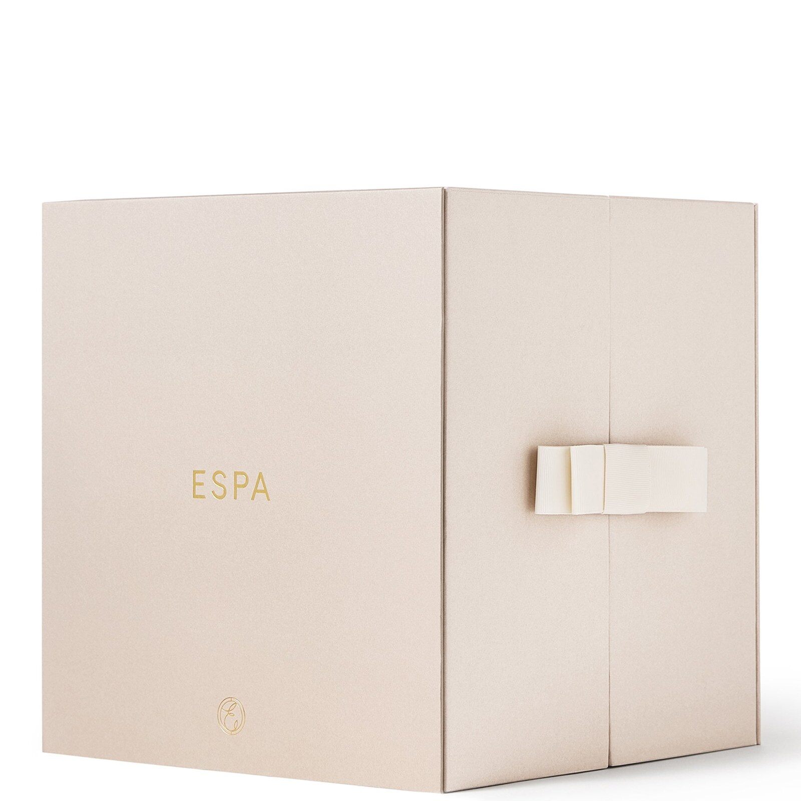 The closed ESPA advent calendar, a cream cube with the ESPA logo and a cream ribbon tied at the front