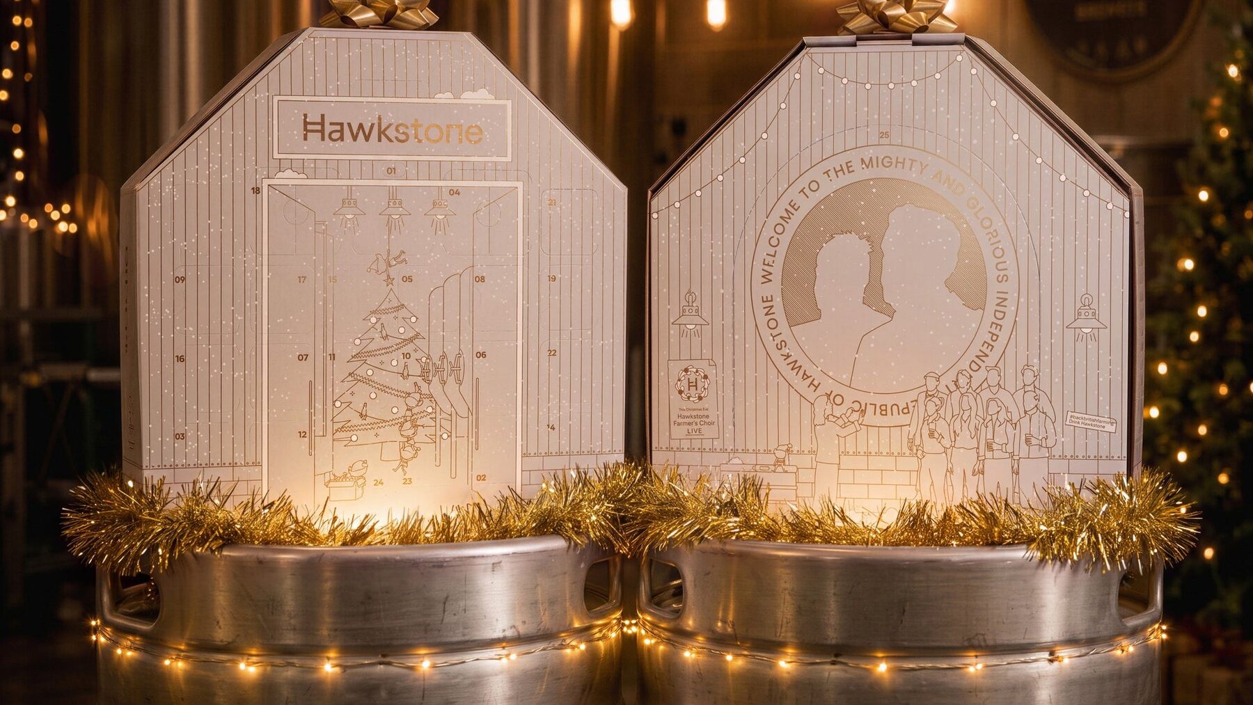 Two Hawkstone advent calendars on beer kegs in the Hawkstone brewery with fairy lights