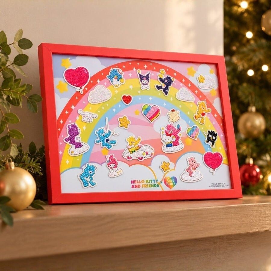 The finished Hello Kitty and Friends x Care Bears crystal art board in a red frame on a shelf next to a Christmas tree