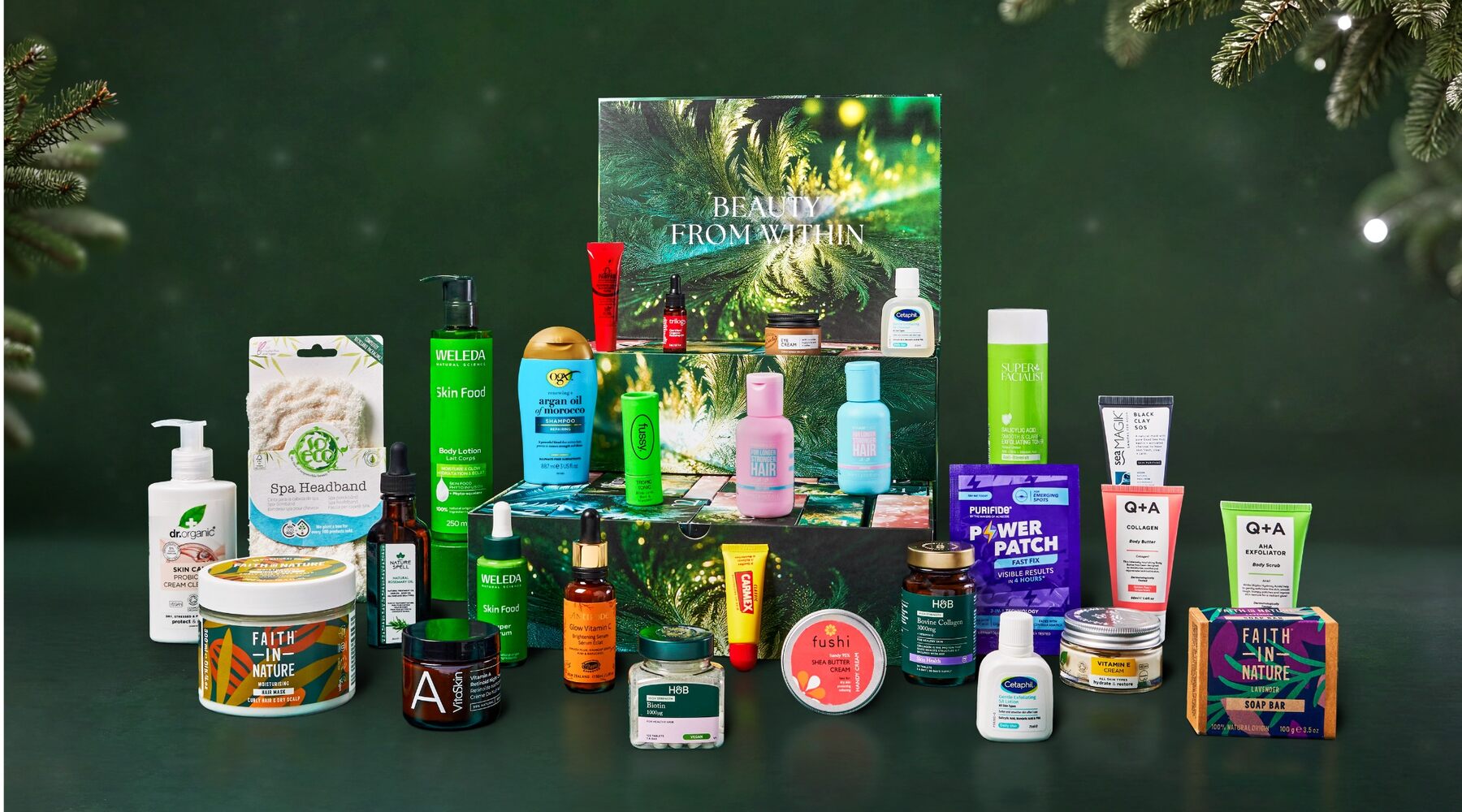 The Holland & Barrett 2026 beauty advent calendar products lined up in front of the open calendar on a dark green background