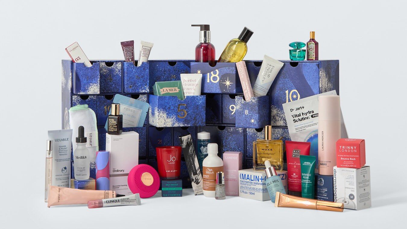 The open John Lewis beauty advent calendar 2026, a blue drawer box, with its beauty products arranged in front