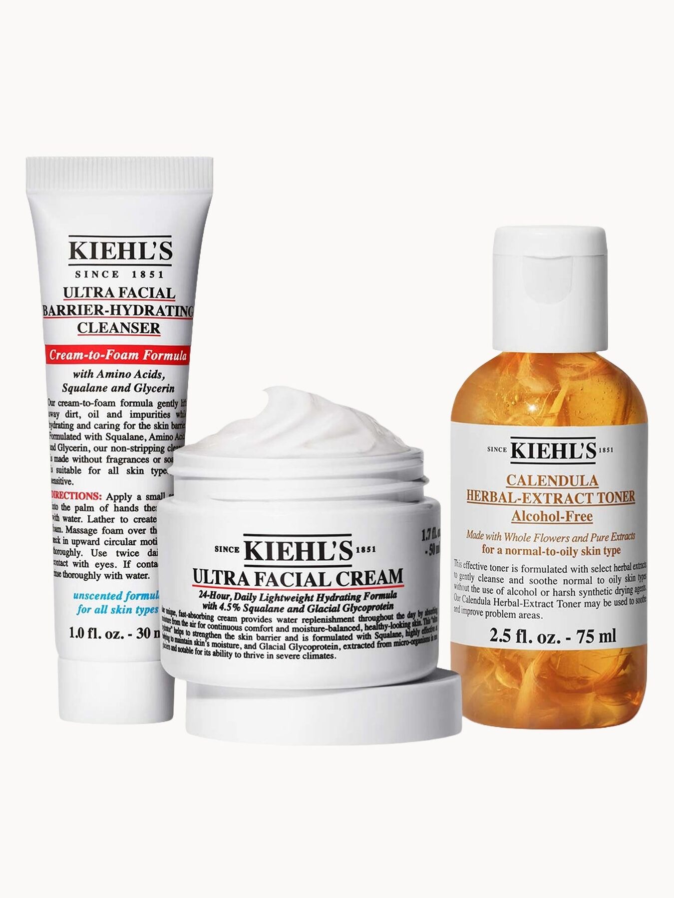 Kiehl's Ultra Barrier Cleanser, Ultra Facial Cream and Calendula Toner on a white background