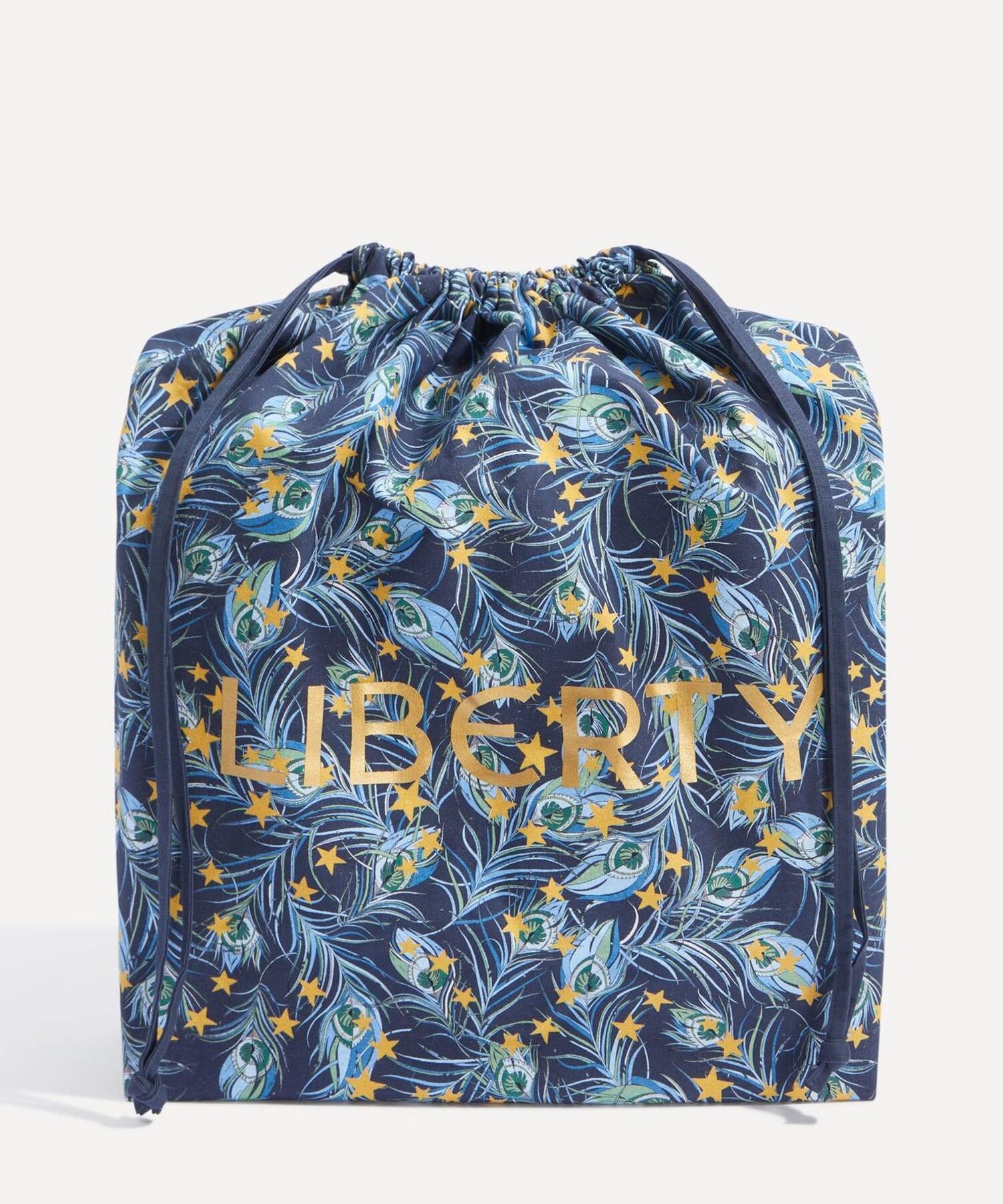 The Liberty print drawstring bag in navy and gold feathers with the Liberty name in gold
