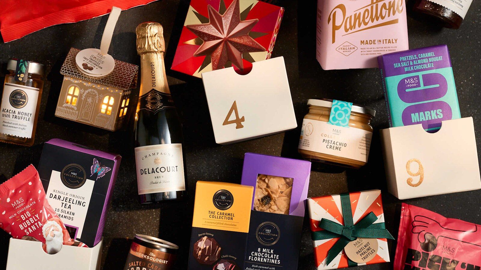 M&S Foodhall treats laid out around the advent calendar doors
