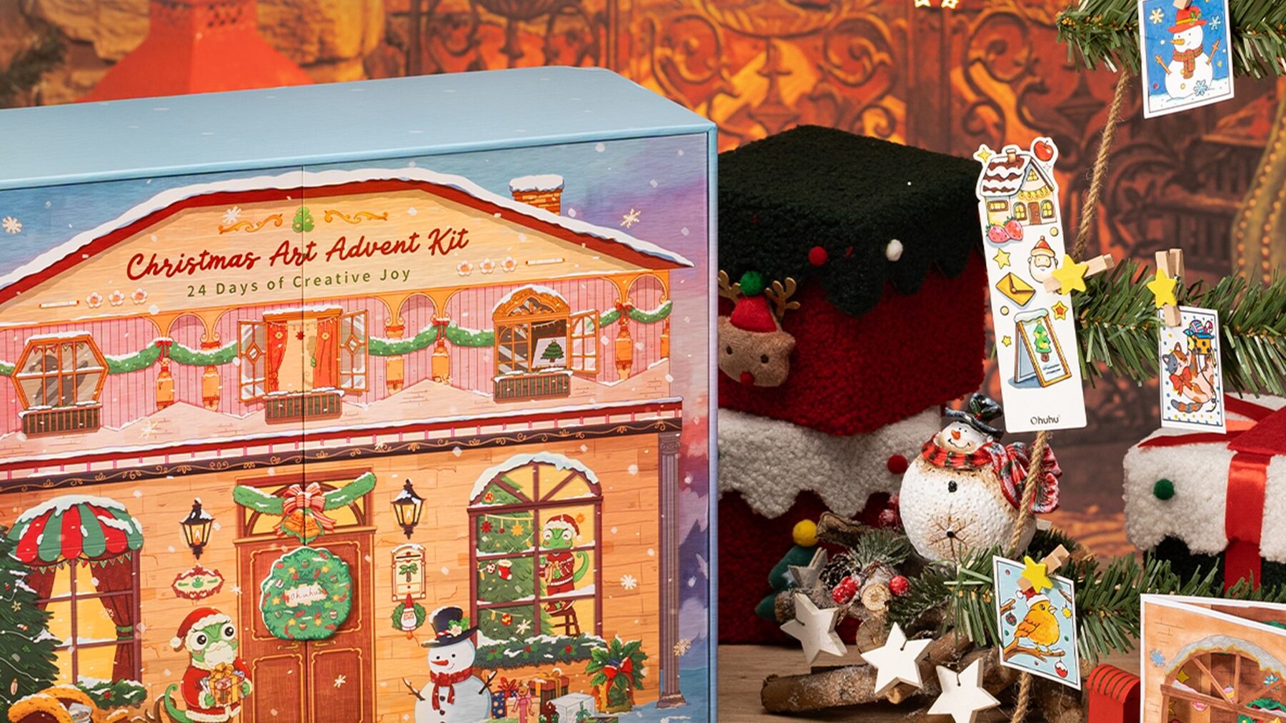 The Ohuhu Christmas Art Advent Kit 2026 in a festive room next to a hanging tree decorated with handmade ornaments
