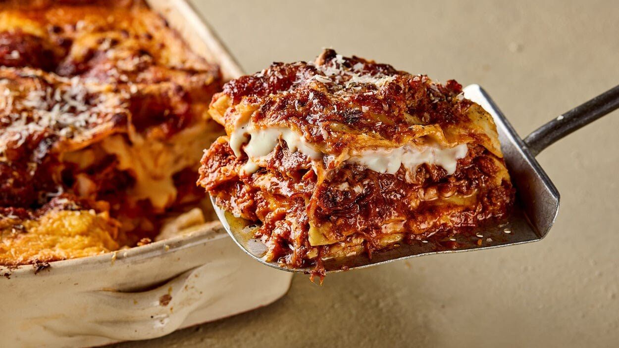 A slice of Pasta Evangelists lasagne with slow cooked beef shin ragù being served