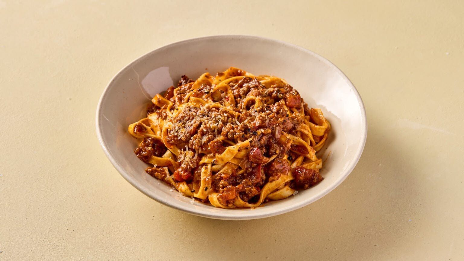 A bowl of Pasta Evangelists Bolognese ragù with egg tagliatelle