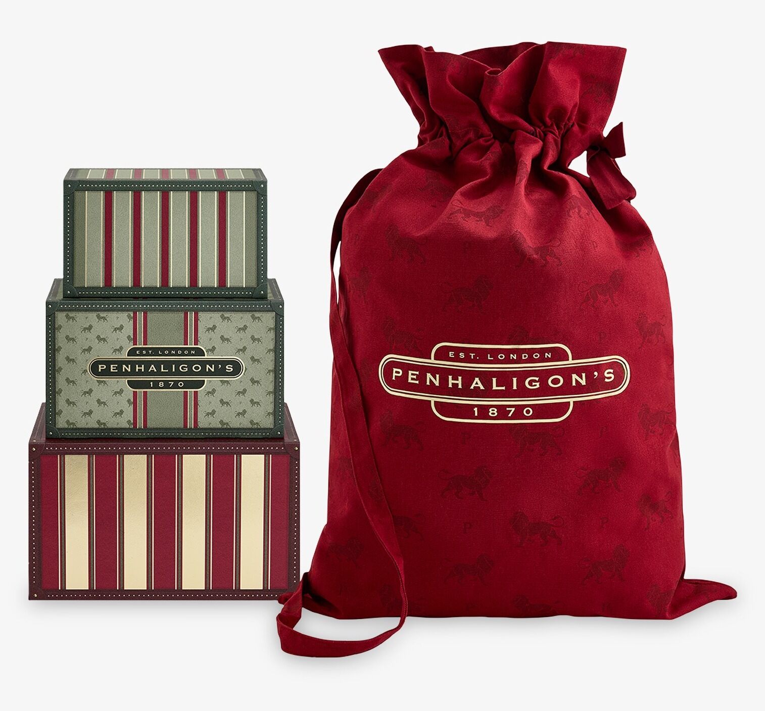 The Penhaligon's advent calendar trunks closed, next to a large red Penhaligon's drawstring bag