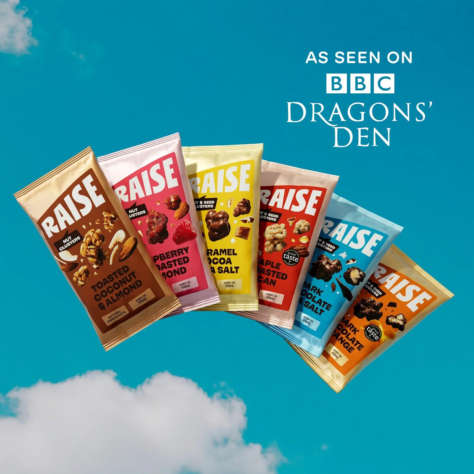 The six RAISE flavours in their colourful 35g bags floating against a blue sky with clouds