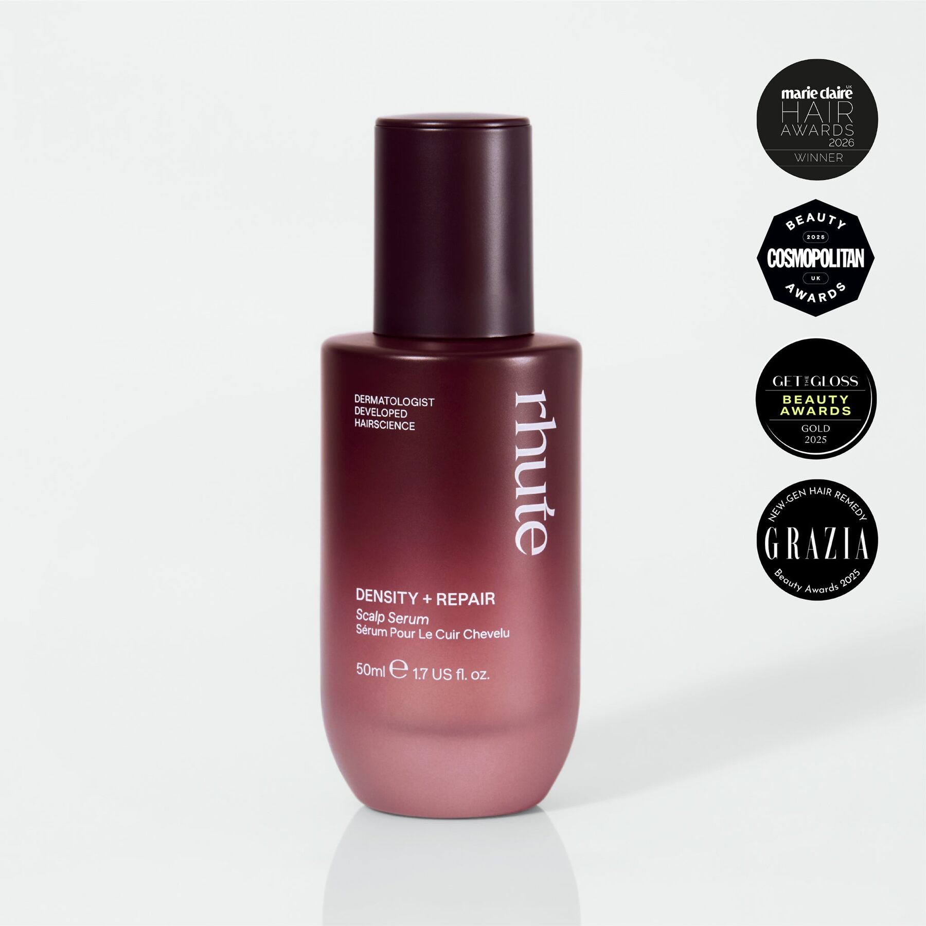 A burgundy bottle of Rhute Density and Repair scalp serum with four UK beauty award badges