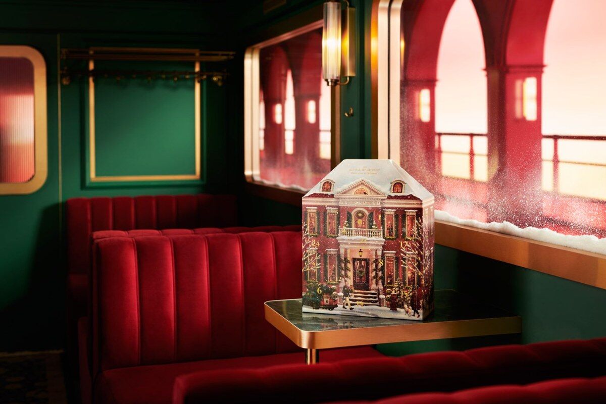 The Rituals Classic advent calendar 2026, a pop-up townhouse with lit windows on a café table