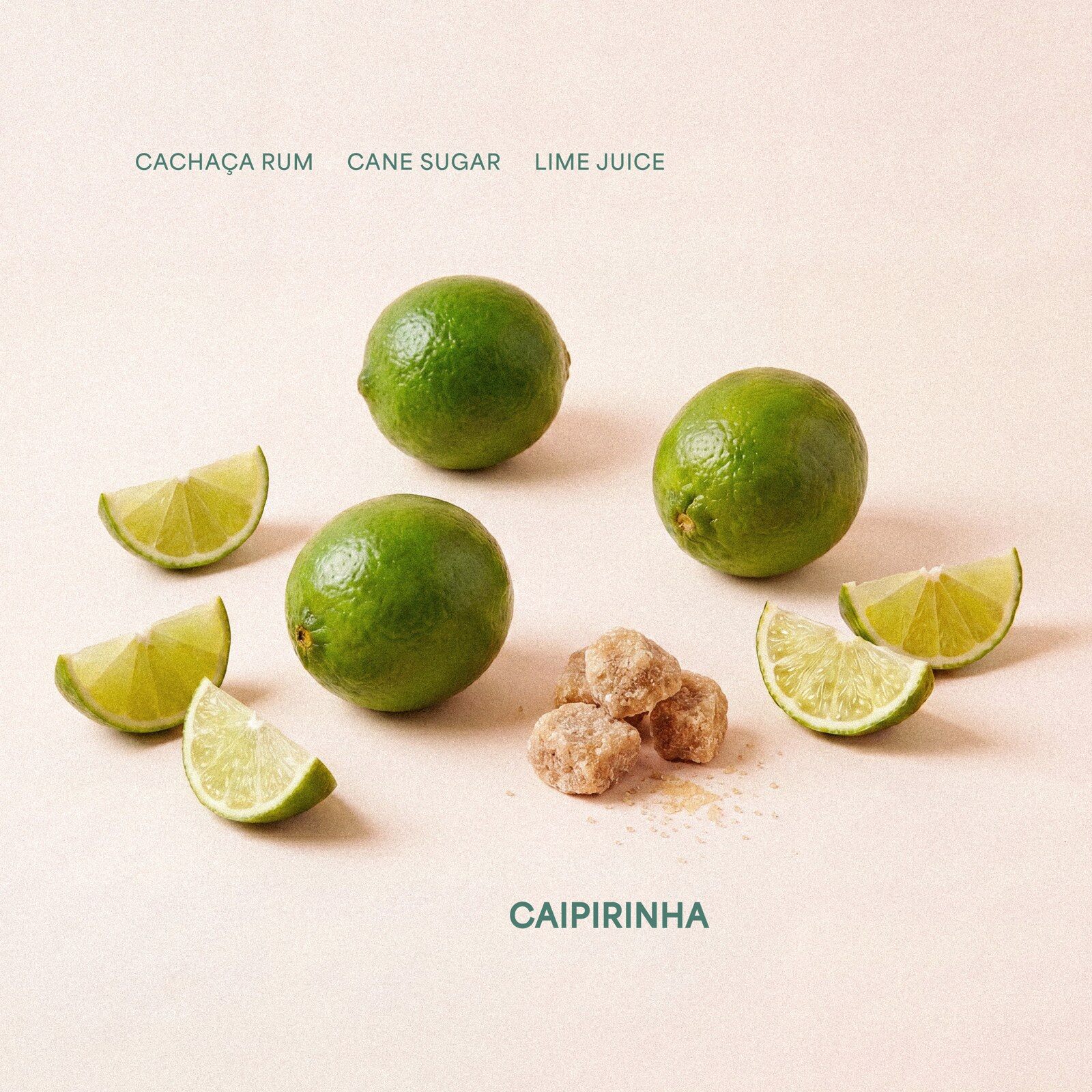Whole limes, lime wedges and cane sugar laid out on a pale background under the Savano Caipirinha ingredient list