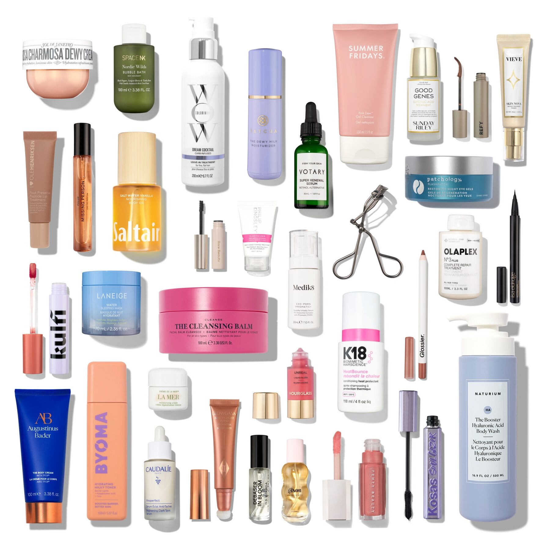 The 35 products of the Space NK advent calendar 2026 laid out on a white background