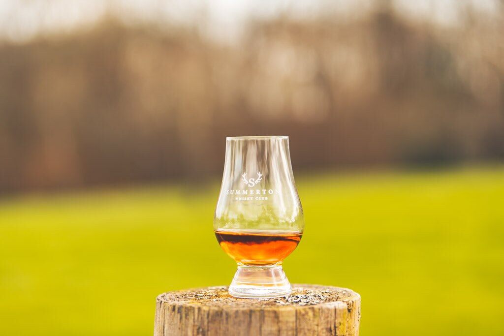 Glass of whisky outdoors from Summerton Whisky Club