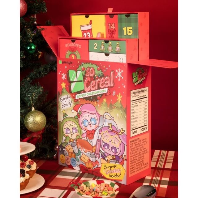 The YesStyle Y So Cereal beauty advent calendar 2026, a red cereal box with open drawers, beside a Christmas tree