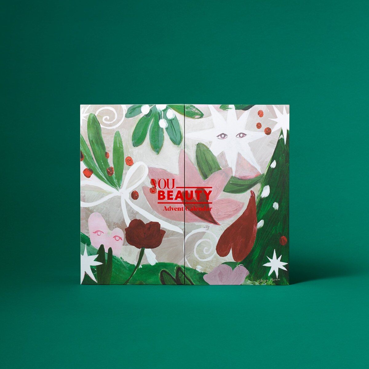 The closed YOU Beauty advent calendar 2026, a white box with a colourful festive illustration on a green background